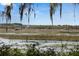 Scenic marsh view with a wooden walkway and a distant gazebo, framed by moss-draped trees at 4020 Betsy Kerrison Pkwy, Johns Island, SC 29455