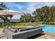 Stylish poolside lounge area featuring modern outdoor furniture, offering tranquil views of the lush surroundings at 4020 Betsy Kerrison Pkwy, Johns Island, SC 29455