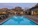 Luxury pool with a stone fireplace and manicured outdoor seating, perfect for evening entertainment at 4020 Betsy Kerrison Pkwy, Johns Island, SC 29455