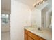 Bathroom with wallpaper, vanity, and mirror, creating a bright and inviting space at 406 Mendenhall St, Summerville, SC 29483