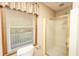 Bathroom with shower stall, toilet, and a window providing natural light at 406 Mendenhall St, Summerville, SC 29483