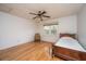 Cozy bedroom featuring hardwood floors, a ceiling fan, and a window with natural light at 406 Mendenhall St, Summerville, SC 29483