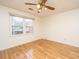 Bright bedroom with hardwood flooring and a large window offering natural light at 406 Mendenhall St, Summerville, SC 29483