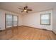 Bright bedroom featuring hardwood floors, a ceiling fan, and natural light from the window at 406 Mendenhall St, Summerville, SC 29483