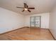 Well-lit bedroom showcases hardwood floors, a ceiling fan, and a serene atmosphere at 406 Mendenhall St, Summerville, SC 29483