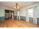 Charming dining area featuring hardwood floors, ample natural light and decorative trim at 406 Mendenhall St, Summerville, SC 29483