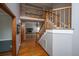 Open foyer with staircase, wood floors, and view of the living room fireplace at 406 Mendenhall St, Summerville, SC 29483
