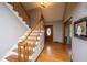 Elegant foyer featuring hardwood floors, staircase, and a wooden front door at 406 Mendenhall St, Summerville, SC 29483