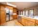 Traditional kitchen featuring wood cabinets, stainless steel appliances, and an eat-in area with window views at 406 Mendenhall St, Summerville, SC 29483
