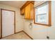 Functional laundry room with overhead cabinets, utility sink connection, and natural light at 406 Mendenhall St, Summerville, SC 29483