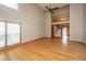Bright, open living room with hardwood floors, a ceiling fan, and a staircase leading to the second floor at 406 Mendenhall St, Summerville, SC 29483
