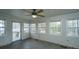 Sunroom with large windows allowing ample light and doorway leading to an outdoor deck space at 406 Mendenhall St, Summerville, SC 29483