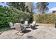 Private backyard patio with comfortable seating surrounding a fire pit, perfect for outdoor entertaining at 4108 Whiting St, Mount Pleasant, SC 29466