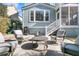 Inviting backyard patio with comfortable seating, a fire pit, and views of the home's exterior at 4108 Whiting St, Mount Pleasant, SC 29466