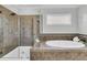 Bright bathroom with a walk-in shower and a separate soaking tub at 4108 Whiting St, Mount Pleasant, SC 29466
