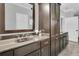 Bathroom vanity with dark cabinets, granite countertops and double sinks at 4108 Whiting St, Mount Pleasant, SC 29466