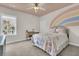 Bright bedroom with rainbow wall mural, ceiling fan and large window at 4108 Whiting St, Mount Pleasant, SC 29466