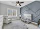 Cozy Bedroom with a modern design, including a comfortable chair and a crib at 4108 Whiting St, Mount Pleasant, SC 29466