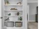 Stylish built-in shelves with decorative items adding character to the living space with views to the hallway at 4108 Whiting St, Mount Pleasant, SC 29466