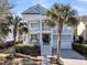 Charming two-story home with a porch, balcony, beautiful landscaping, and a two car garage at 4108 Whiting St, Mount Pleasant, SC 29466