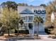 Charming two-story home with a porch, balcony, and a two car garage at 4108 Whiting St, Mount Pleasant, SC 29466