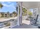 Relaxing front porch view with rocking chairs overlooking a pond, offering a charming outdoor seating area at 4108 Whiting St, Mount Pleasant, SC 29466