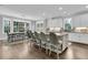 Spacious kitchen and dining area featuring an island with seating, stainless appliances, and abundant natural light at 4108 Whiting St, Mount Pleasant, SC 29466