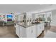 Spacious kitchen with a large center island featuring granite countertops and seating with an adjoining living room at 4108 Whiting St, Mount Pleasant, SC 29466