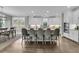 Open-concept kitchen featuring an island with bar seating, stainless appliances, and an adjacent dining area at 4108 Whiting St, Mount Pleasant, SC 29466