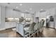 Well-appointed kitchen with an island, stainless appliances, granite countertops, and hardwood flooring at 4108 Whiting St, Mount Pleasant, SC 29466