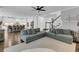 Open-concept living room showcasing hardwood floors, comfortable seating, and a seamless flow to the kitchen at 4108 Whiting St, Mount Pleasant, SC 29466