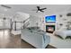 Bright living space with fireplace, built-in shelving, and comfortable seating next to a staircase at 4108 Whiting St, Mount Pleasant, SC 29466