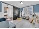 Spacious playroom with lots of light, featuring a sliding barn door, and fun toys and decor at 4108 Whiting St, Mount Pleasant, SC 29466