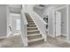 Carpeted staircase with white railings leading to the upper level of the home at 4108 Whiting St, Mount Pleasant, SC 29466