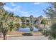 Picturesque view of a serene lake surrounded by trees and greenery at 4108 Whiting St, Mount Pleasant, SC 29466