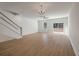 Open living space with hardwood floors, staircase, ceiling fan, and sliding glass door to the outside at 418 Duskywing Dr, Goose Creek, SC 29445