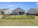 Fenced backyard of home on a sunny day at 422 Switchgrass Dr, Summerville, SC 29486