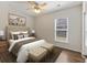 Cozy bedroom with a comfortable bed, soft lighting, and a window view, ideal for rest and relaxation at 422 Switchgrass Dr, Summerville, SC 29486