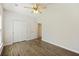 Bedroom with wood-look flooring, bright light and double door closet at 422 Switchgrass Dr, Summerville, SC 29486