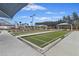 Bocce ball court with ample seating, shade canopies, and beautiful landscaping at 422 Switchgrass Dr, Summerville, SC 29486