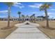 Stunning clubhouse with palm trees, complemented by a beautiful walkway and lush surroundings at 422 Switchgrass Dr, Summerville, SC 29486