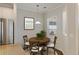 Eat-in kitchen dining area features a round wood table and window to let the sunshine in at 422 Switchgrass Dr, Summerville, SC 29486