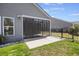 View of the screened-in porch attached to home and yard with a metal fence at 422 Switchgrass Dr, Summerville, SC 29486