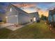 Charming single-Gathering home with a two-car garage, gray siding, and well-manicured lawn at 422 Switchgrass Dr, Summerville, SC 29486
