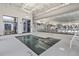 Indoor pool featuring accessibility assistance equipment, ample lighting, and poolside seating at 422 Switchgrass Dr, Summerville, SC 29486