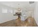 Modern kitchen boasts stainless steel appliances, granite countertops, an island, and hardwood floors, perfect for entertaining at 422 Switchgrass Dr, Summerville, SC 29486