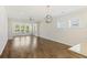 Spacious open living room with hardwood floors and a connecting sunroom at 422 Switchgrass Dr, Summerville, SC 29486
