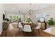 Cozy living room and eat-in kitchen dining area with neutral decor, lots of light, and modern furnishings at 422 Switchgrass Dr, Summerville, SC 29486