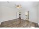 The main bedroom features a ceiling fan, hardwood floors, and a view of the ensuite bathroom at 422 Switchgrass Dr, Summerville, SC 29486