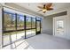 Sunroom features a ceiling fan, screened-in windows, and view of the backyard at 422 Switchgrass Dr, Summerville, SC 29486